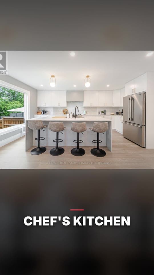 A frame from the middle of the reel: a photograph of the kitchen, captioned CHEF’S KITCHEN across the lower third above a short rule in the brokerage’s red.